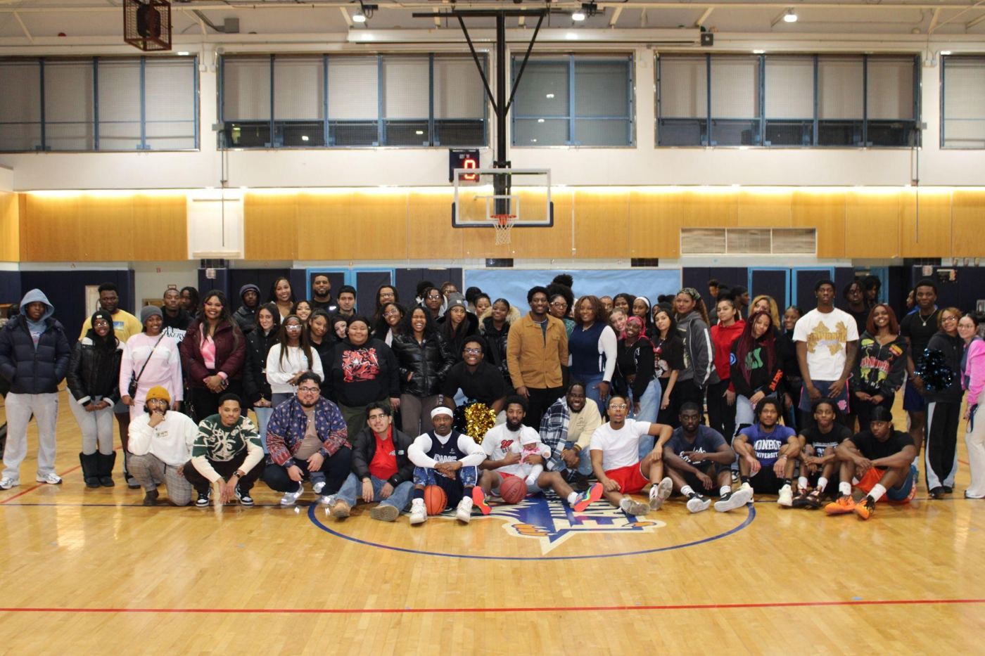 Staff vs. Alumni basketball players and fans